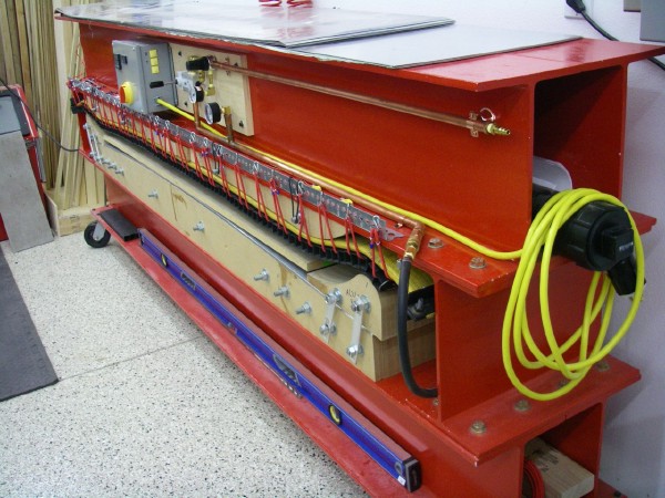 Pneumatic press at Happy Monkey Snowboards, Inc.