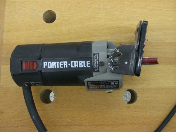 Laminate trimmer with tilt base.